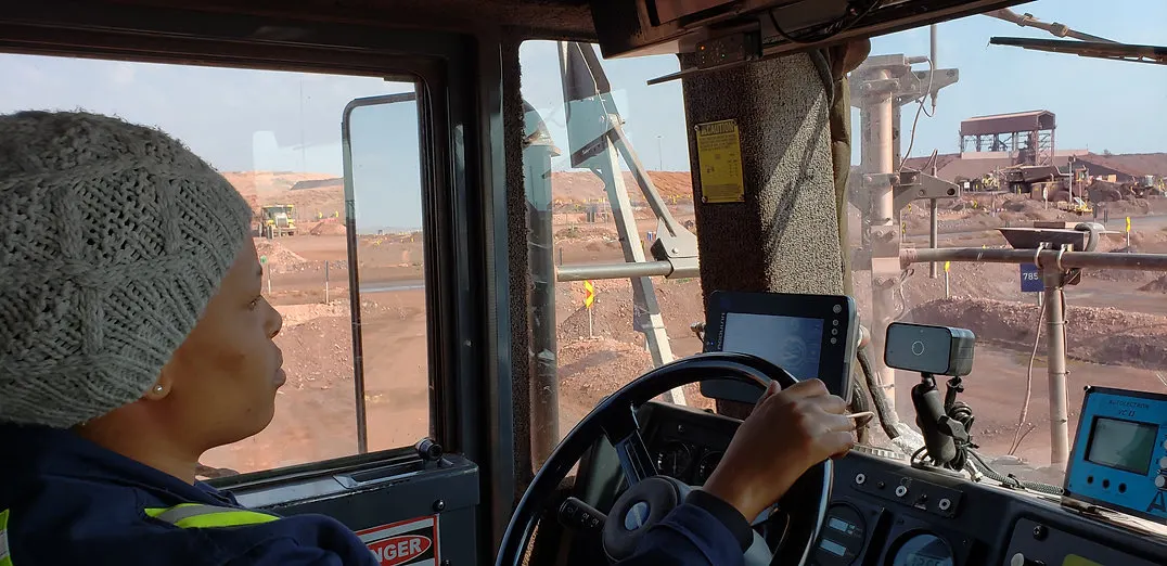 Haul-truck operator in a cab fitted with in-cab displays